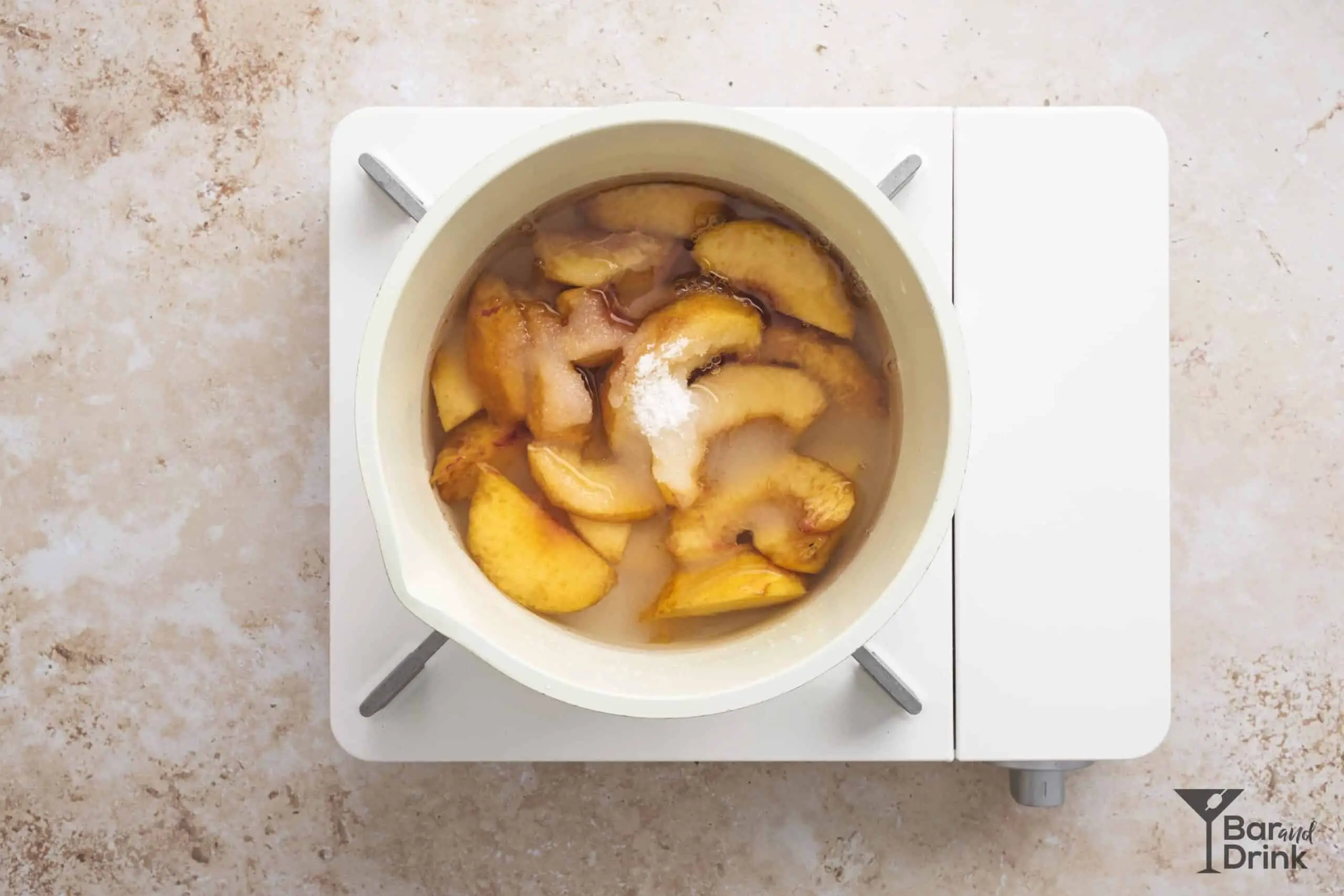 peach whiskey sour process water and sugar sauce pan
